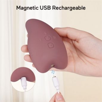 Close-up of the Momcozy Lactation Massager in Purple being charged via its Magnetic USB Rechargeable system. Highlights the convenient, fast-power-up feature and compact design, ideal for busy breastfeeding mothers at CHS Pharmacy UAE.