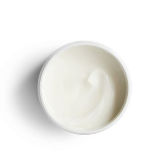 Creamy white texture of Reistill Colour Care Hair Mask with Silk Protein in open round jar, top view